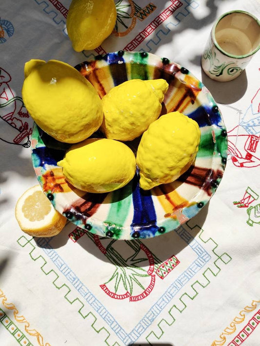 Handmade ceramic lemons in a bowl