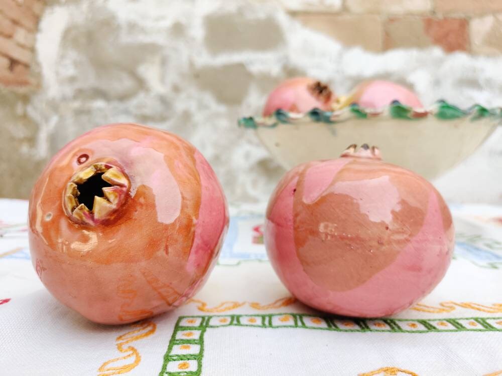 two ceramic pomegranates